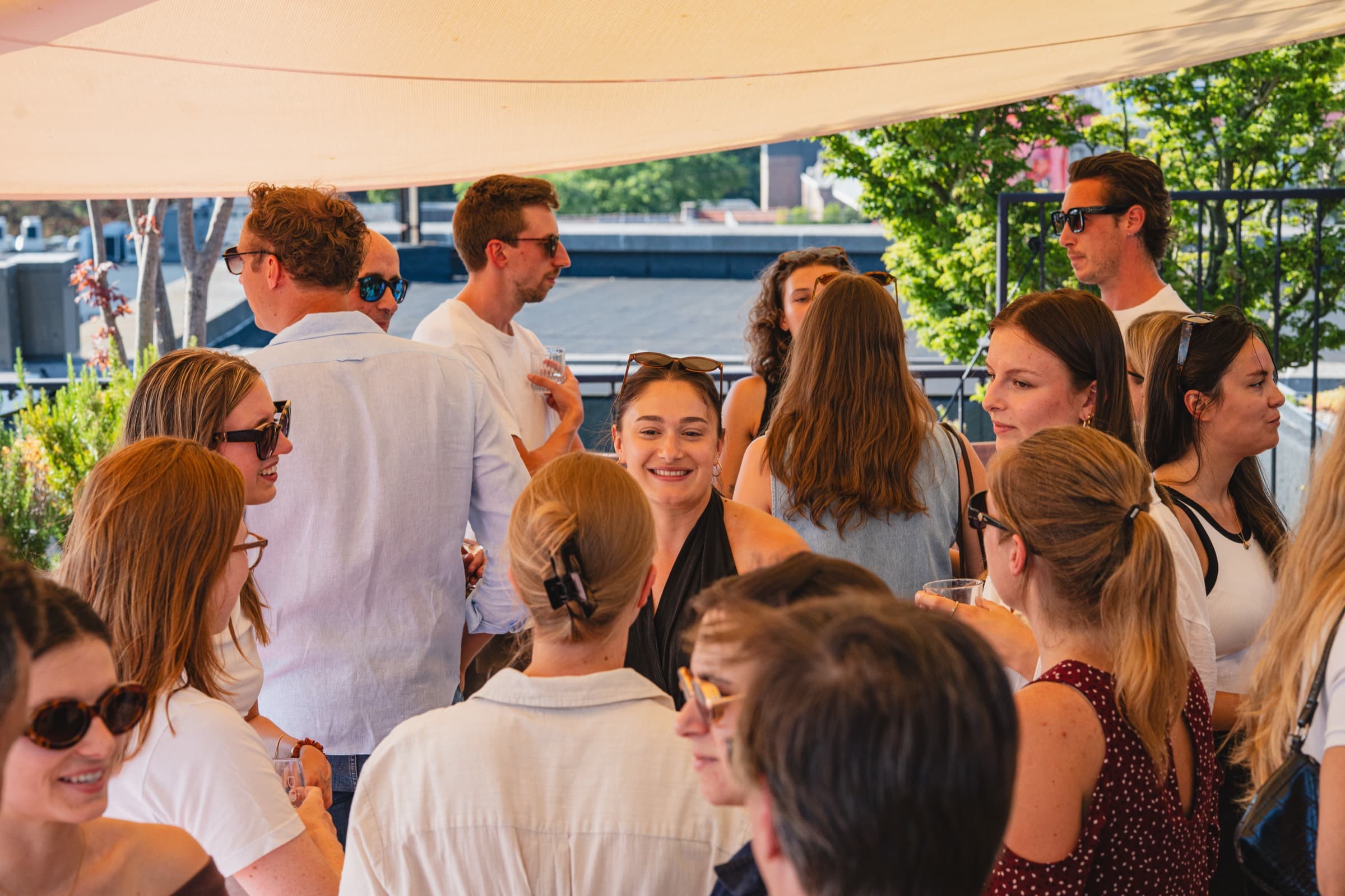 People from the 212° agencies talking together at a summer gathering